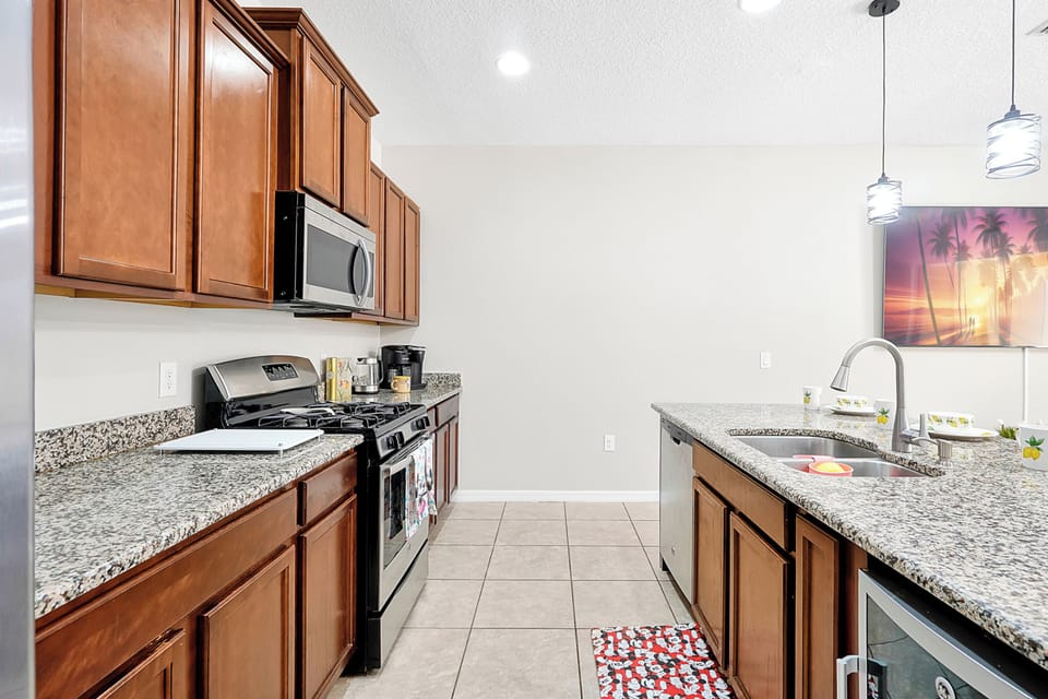 Fully equipped modern kitchen with stainless steel appliances