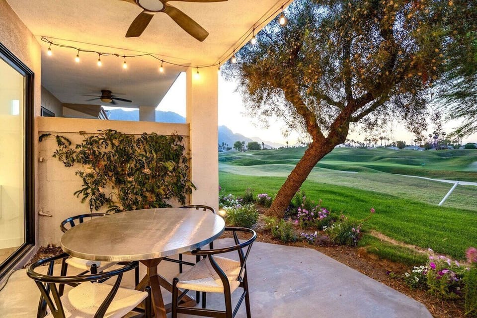 The covered patio features a fan sure to keep you cool and seats four.