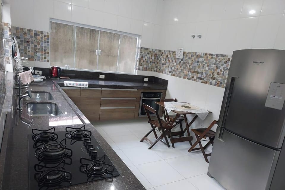 Full-size fridge, oven, stovetop, cookware/dishes/utensils