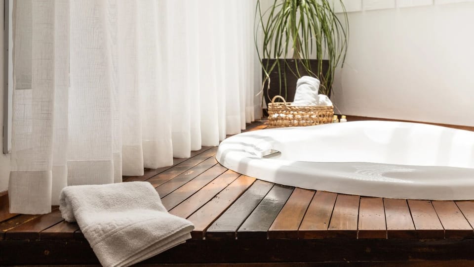 Suite deluxe com banheira  | Living area