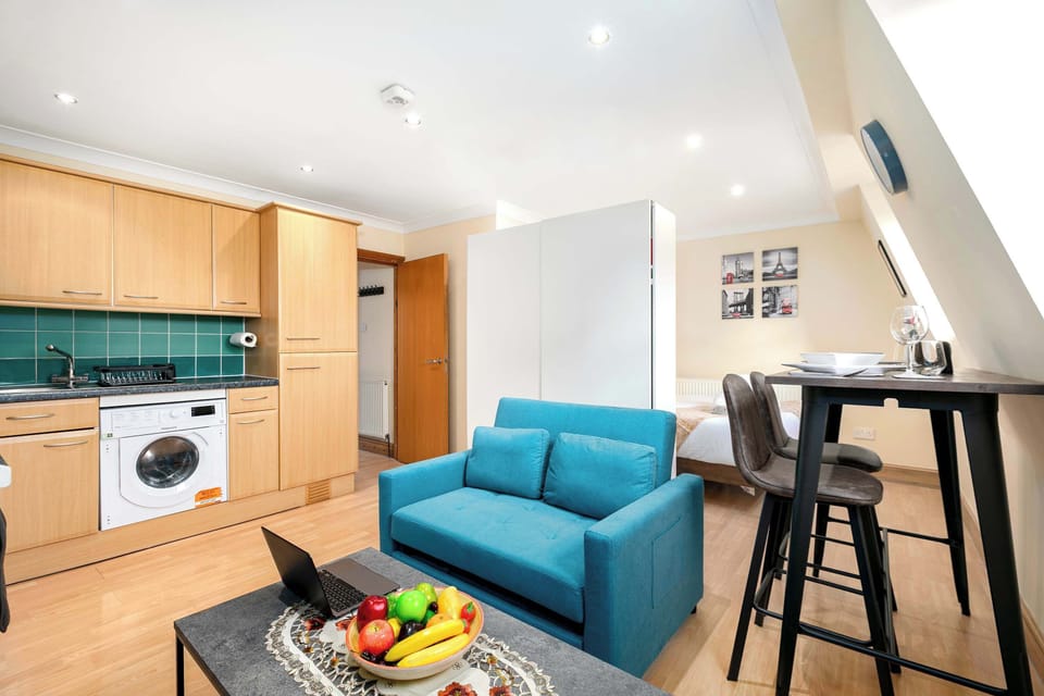 Bright and welcoming lounge area featuring a comfortable sofa bed and cosy seating—the perfect place to relax, unwind and spend quality time together