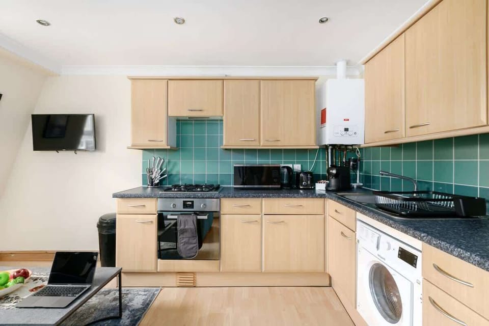 Kitchenette with amenities and cooking essentials 