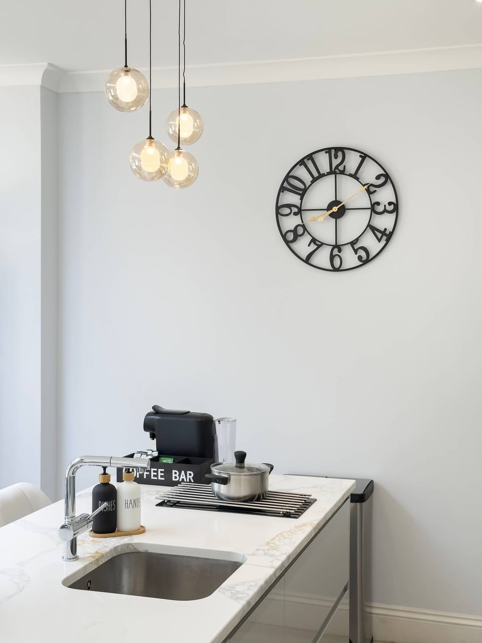 Bright, contemporary kitchen with a central island and all the essentials, making meal preparation simple, enjoyable and convenient