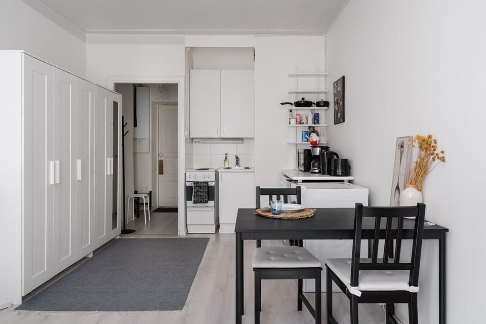 Gather around this cozy dining table, perfect for shared meals, casual work sessions, or late-night card games.
