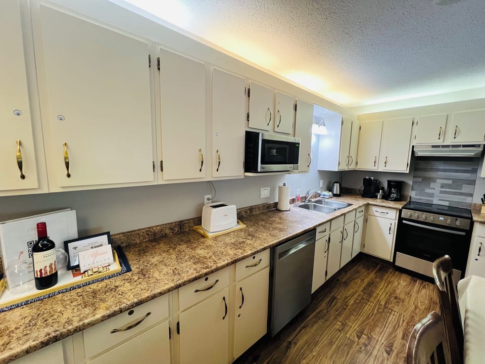 A full Kitchen with modern appliances, dining and open plan concept. You'll have everything you'll need to feed and entertain the crew.