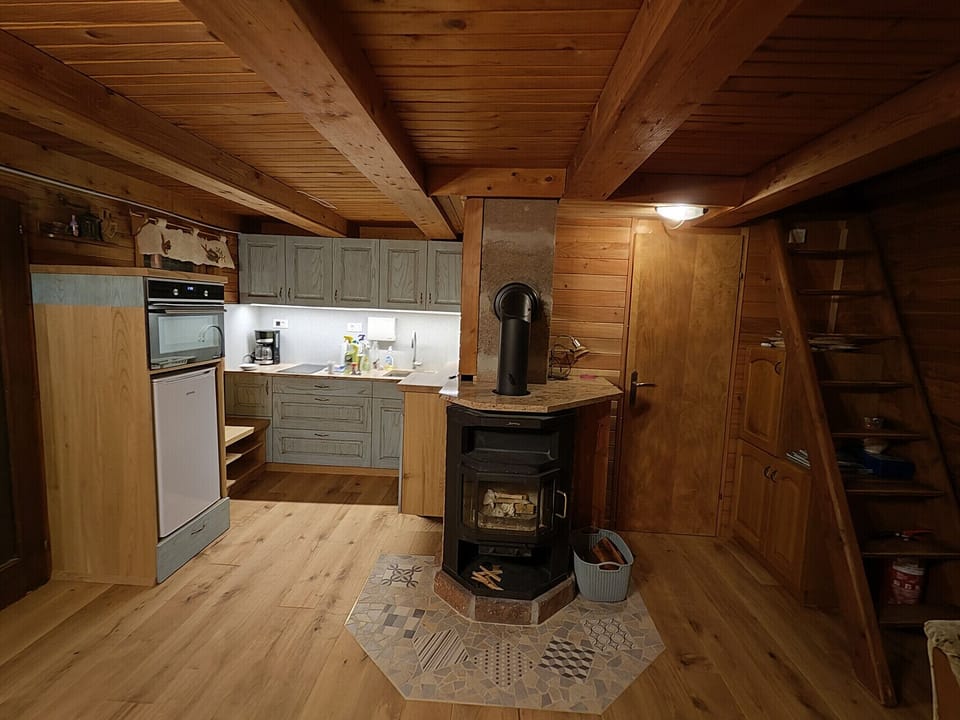 Kitchen on the left, bathroom door and stairs to the bedroom.