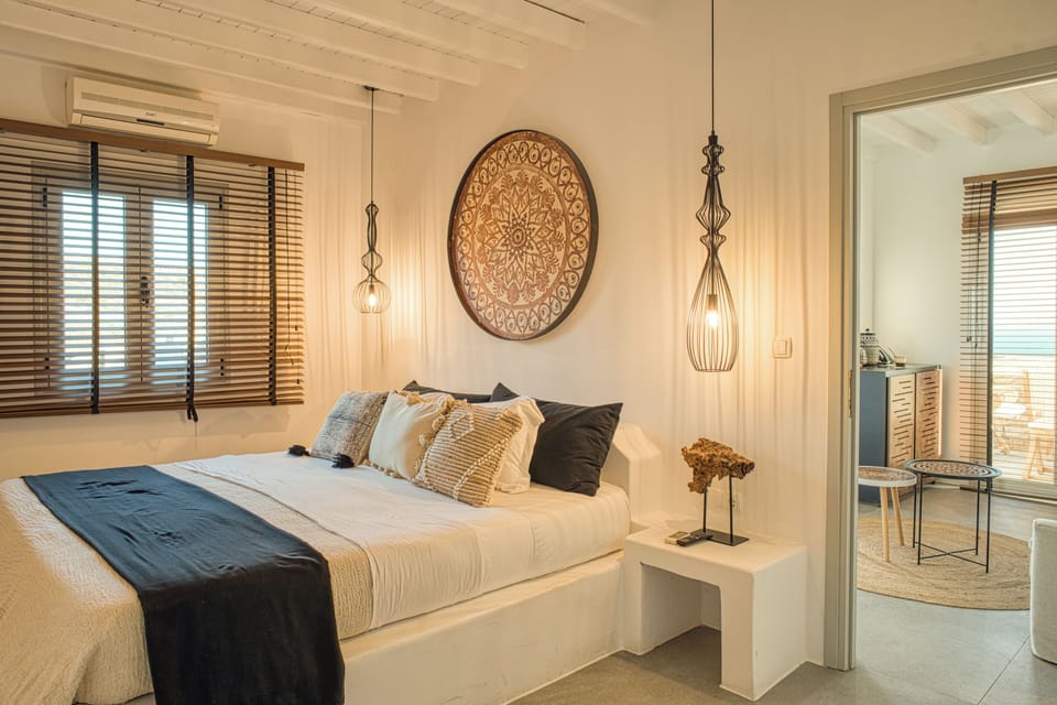 Deluxe Triple Room, Sea View | Minibar, in-room safe, individually decorated, individually furnished