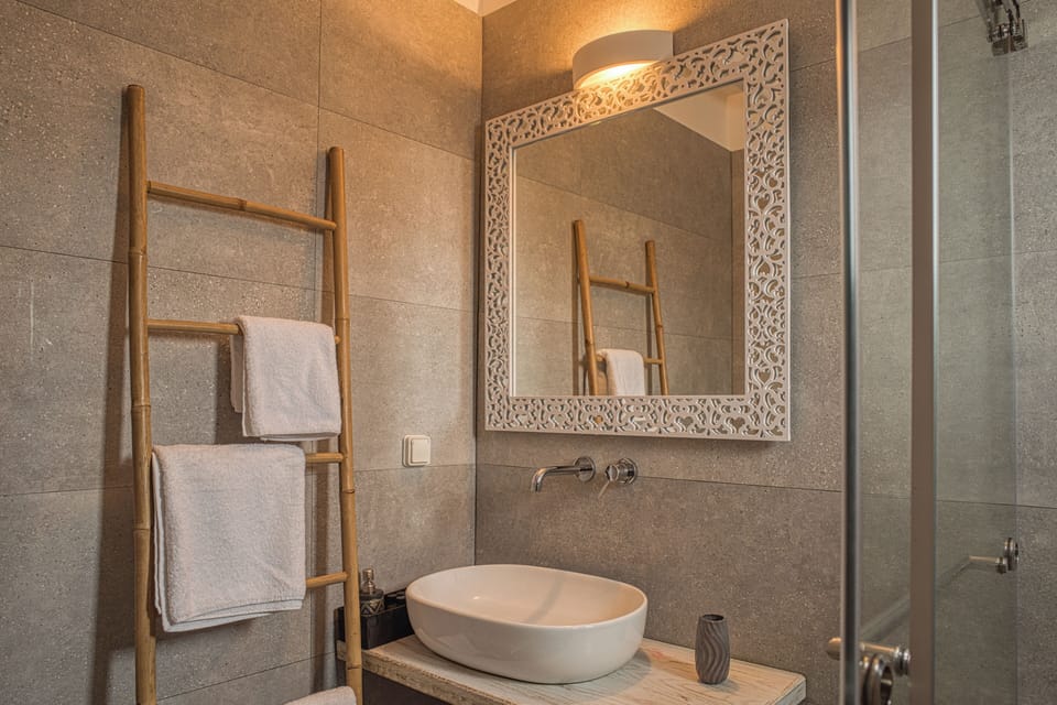Deluxe Triple Room, Sea View | Minibar, in-room safe, individually decorated, individually furnished