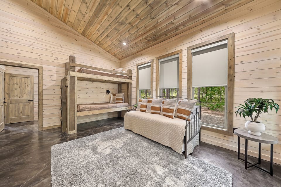 Bedroom 3: Cozy and captivating!  Enjoy the roller shades for a good night’s sleep.