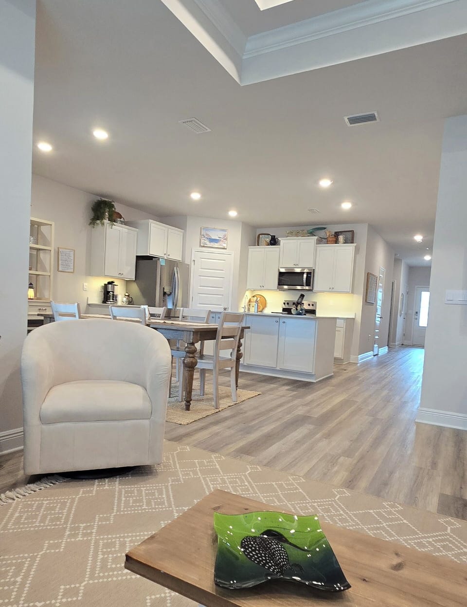 Living room open to the dining and the kitchen, with pantry