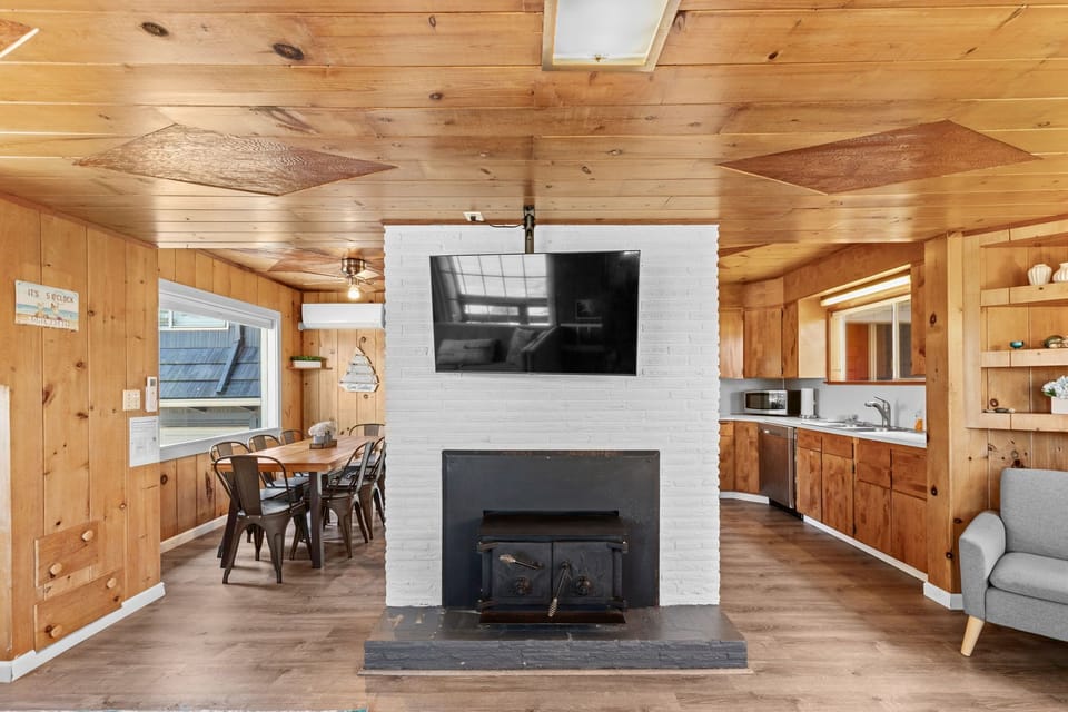 Open floor plan connecting living area, kitchen, and dining space for easy flow and great entertaining.