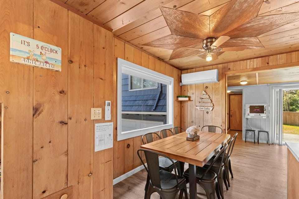 Spacious dining table seating 8, perfect for enjoying meals together with family and friends.