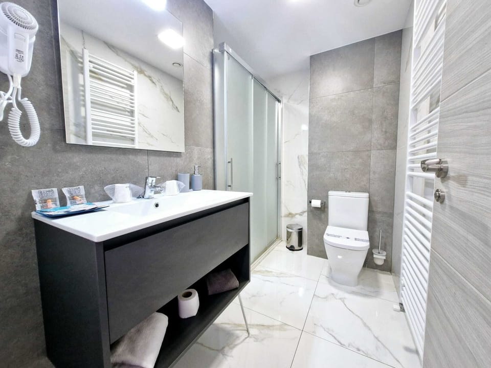 Standard Double Room, City View | Bathroom | Shower, hair dryer, soap, toilet paper