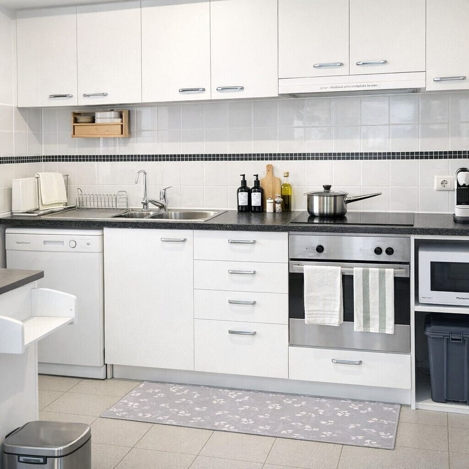Modern kitchen with full-size fridge, oven, stovetop, microwave, air fryer, rice cooker, dishwasher, and all cooking essentials. Fully stocked with cookware, utensils, and pantry basics — ideal for everything from light snacks to full meals.