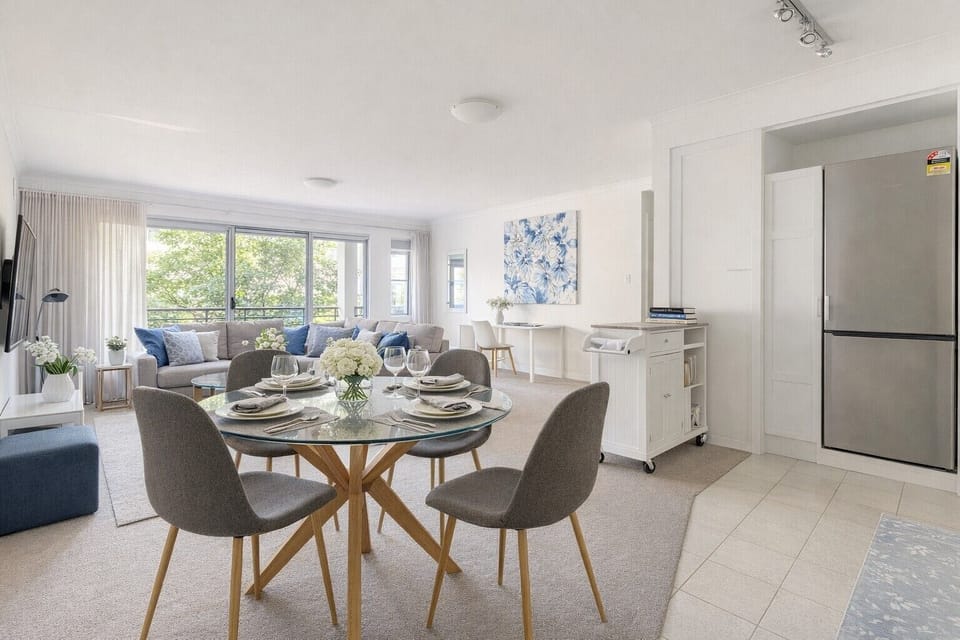 Gather around the modern glass dining table that comfortably seats four. Set in an open-plan layout with natural light and elegant décor, it’s the perfect spot for meals, coffee chats, or planning your next adventure