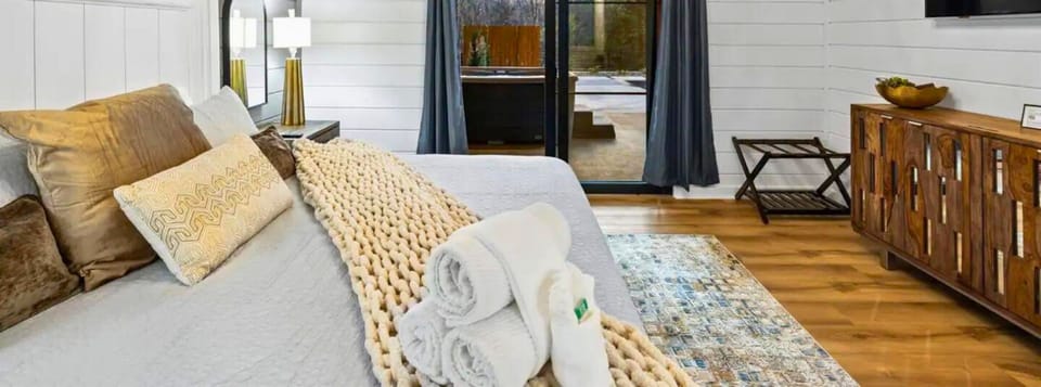 Let the plush comfort of this King bedroom be your evening's retreat, with the bonus of stepping out to nature's doorstep.
