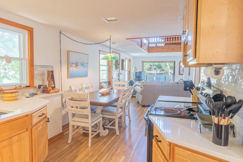 The main floor features an open-concept living, dining, and kitchen area