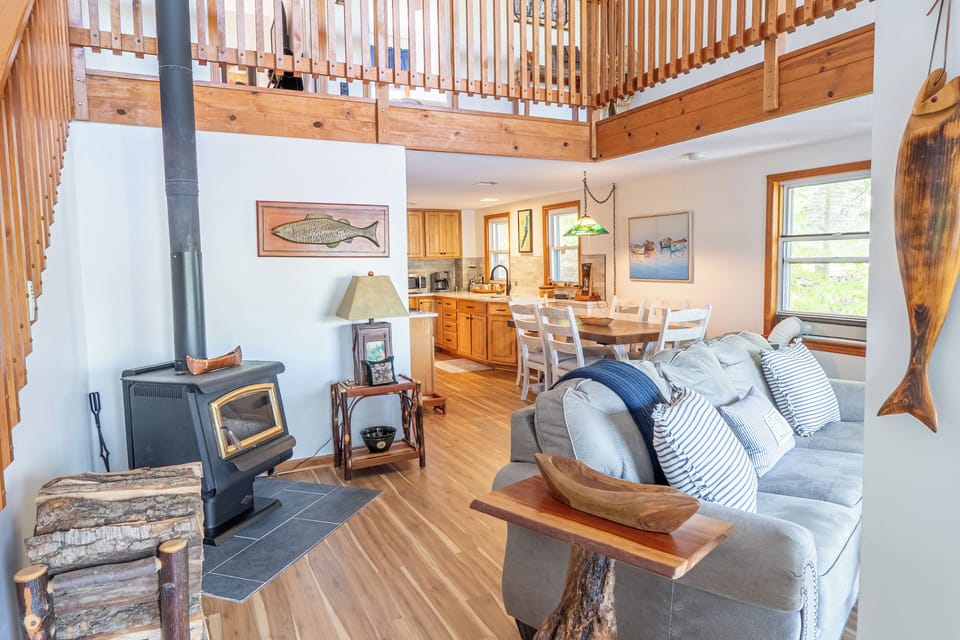 The main floor features an open-concept living, dining, and kitchen area