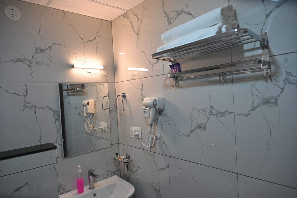 Shower, free toiletries, hair dryer, slippers