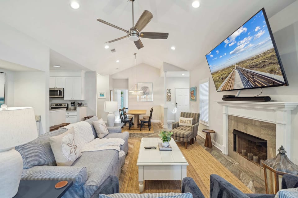 Bright living area with ample seating and Smart TV