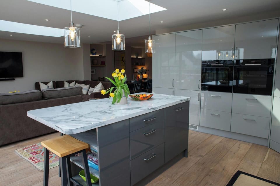 Kitchen with island and double electric ovens