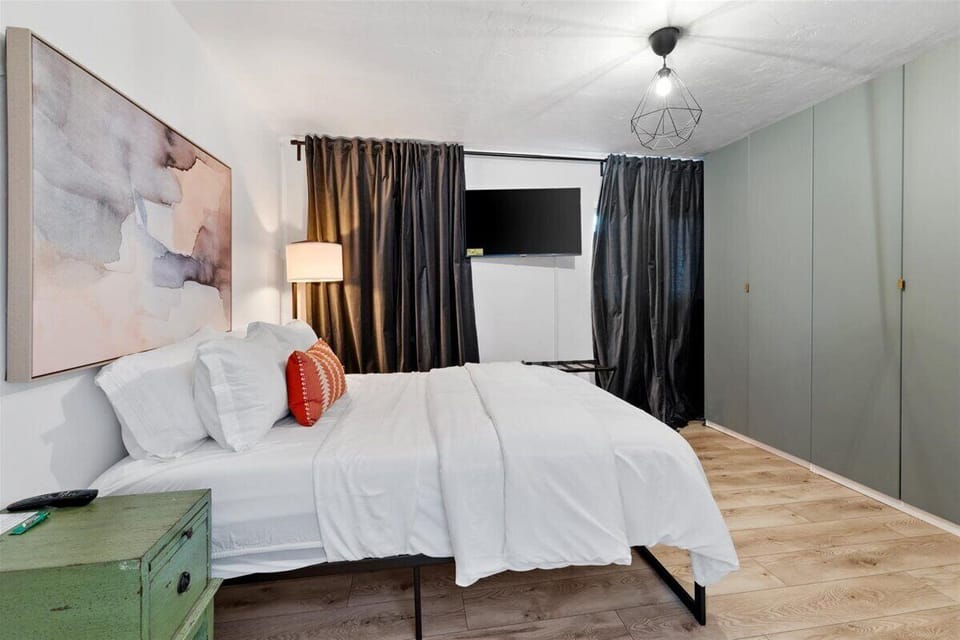 - Stylish bedroom with modern décor and warm lighting accents - Comfortable bedding and TV for cozy movie nights after adventures - Spacious layout offers a relaxing Arizona stay for every guest