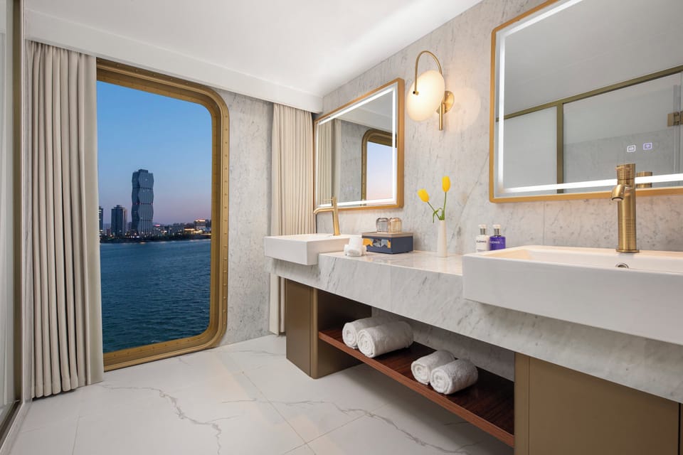 1 King Suite | Bathroom | Shower, designer toiletries, hair dryer, bathrobes