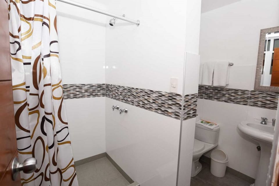 Shower, rainfall showerhead, hair dryer, towels