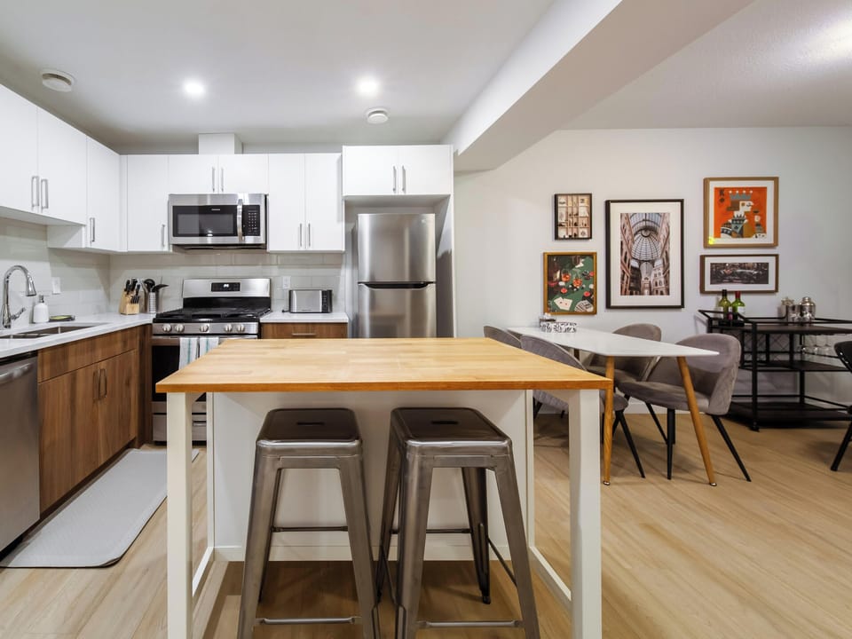 Full kitchen with island seating and dining area