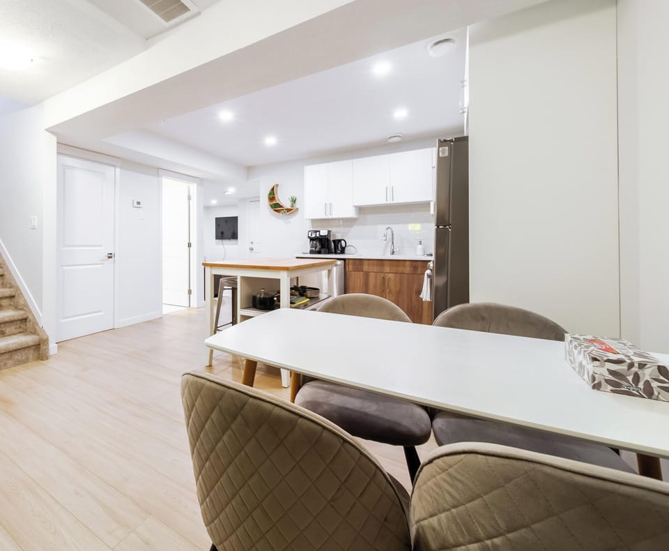Open layout connecting kitchen, dining, and hangout zones