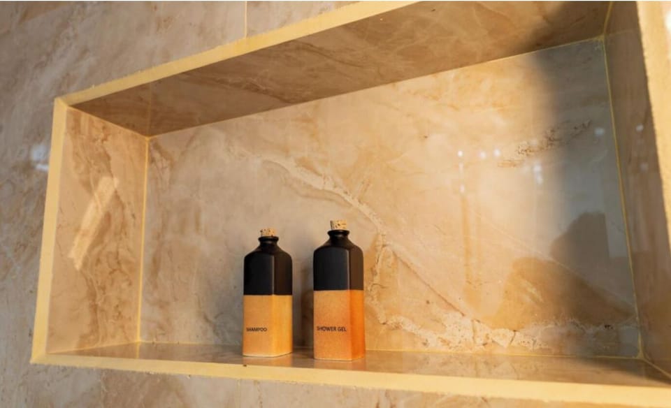 Suite, Garden View | Bathroom | Shower, free toiletries, towels, soap