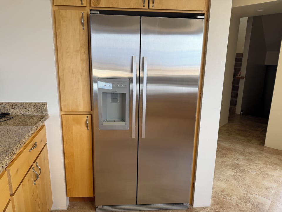 Fishel and Paykel refrigerator with ice maker and water dispenser