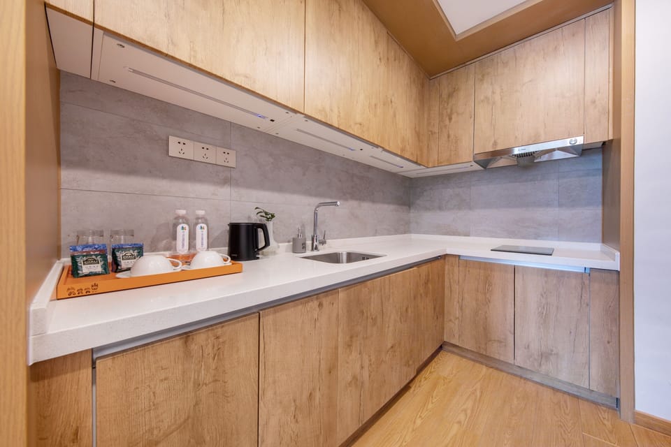 Mini-fridge, stovetop, cookware/dishes/utensils