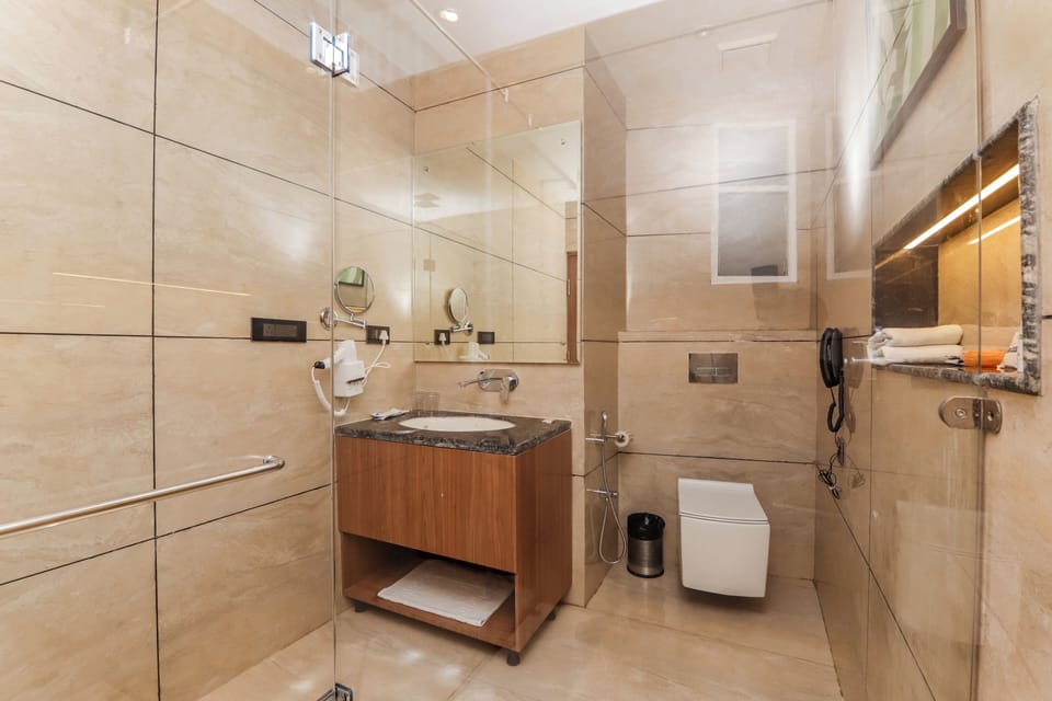 Presidential Quadruple Room | Bathroom | Shower, free toiletries, towels, soap