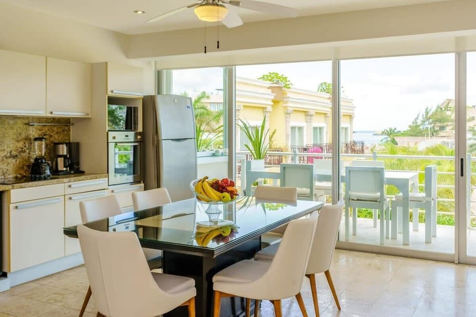 Dining area with table for six; enjoy delicious meals.