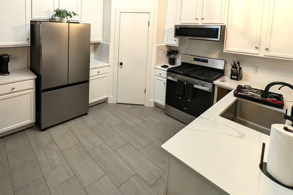 Kitchen with stainless steel appliances, toaster, Keurig coffee maker and blender