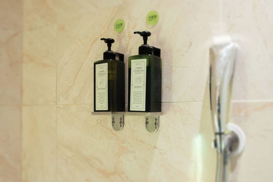 Classic Quadruple Room | Bathroom | Shower, hair dryer, slippers, towels