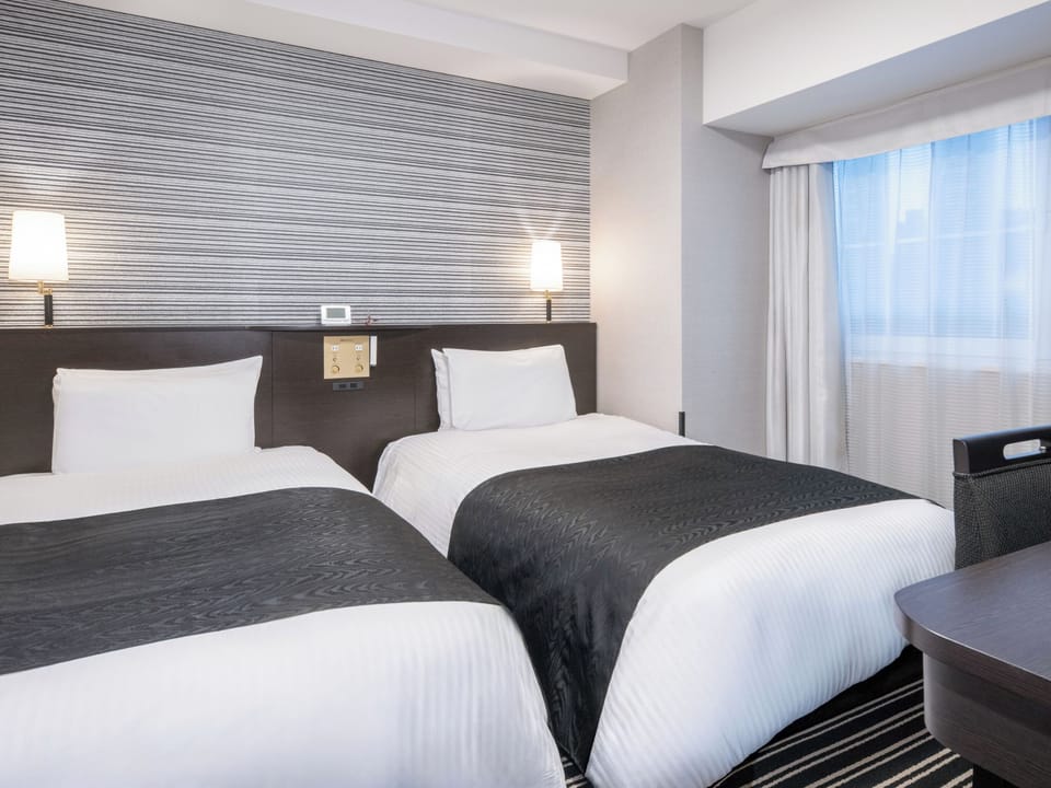 Premium bedding, down comforters, desk, laptop workspace