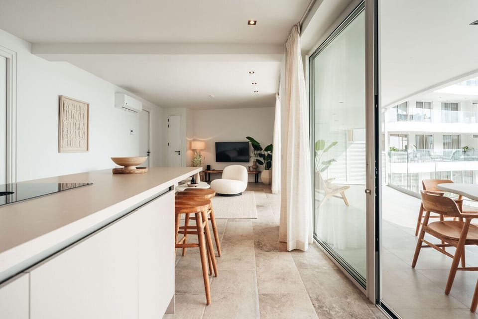 Experience seamless indoor-outdoor living! Where comfort meets style, complete with a cozy seating area and stunning views through the glass doors.