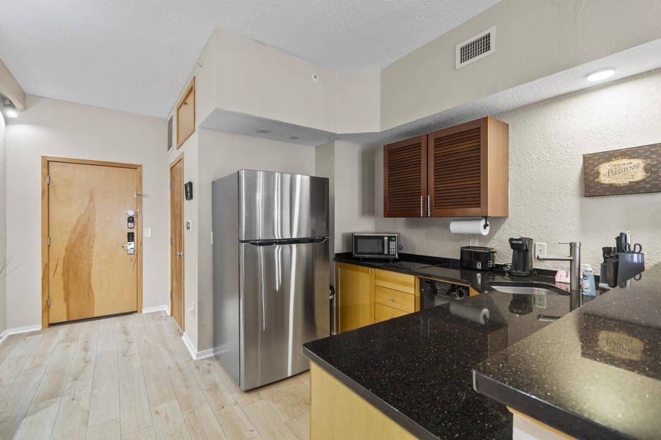 Step into the Tuscan Breeze Getaway condo and be greeted by an open-concept living space, bright natural light, and a warm, inviting atmosphere.