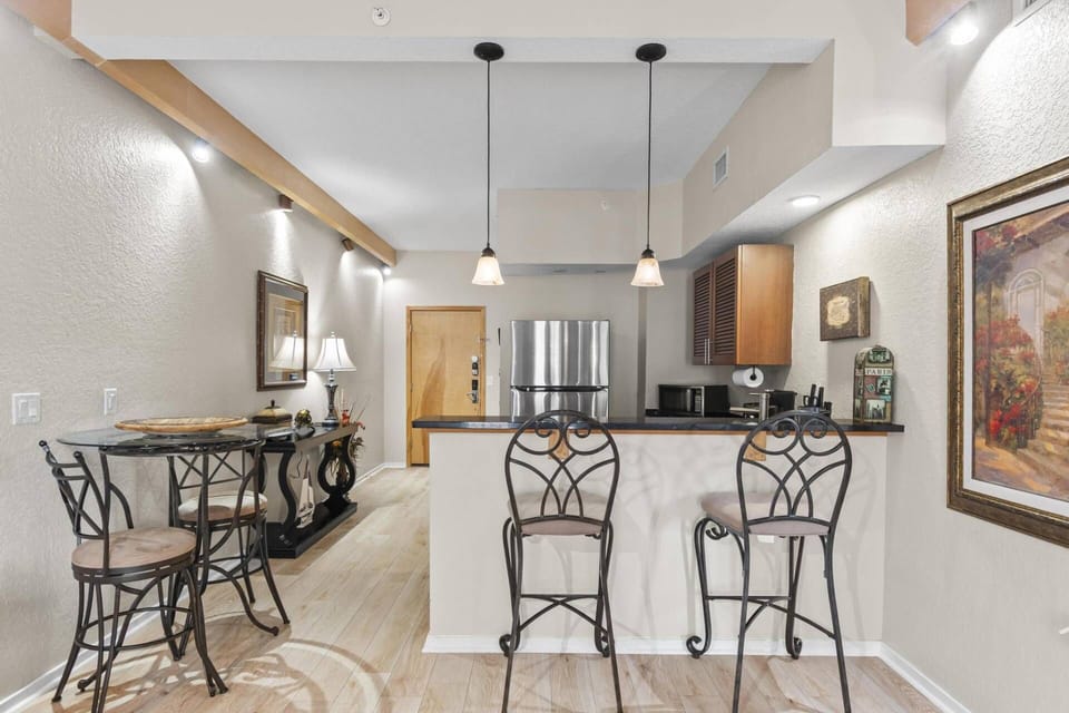 Step into the Tuscan Breeze Getaway condo and be greeted by an open-concept living space, bright natural light, and a warm, inviting atmosphere.