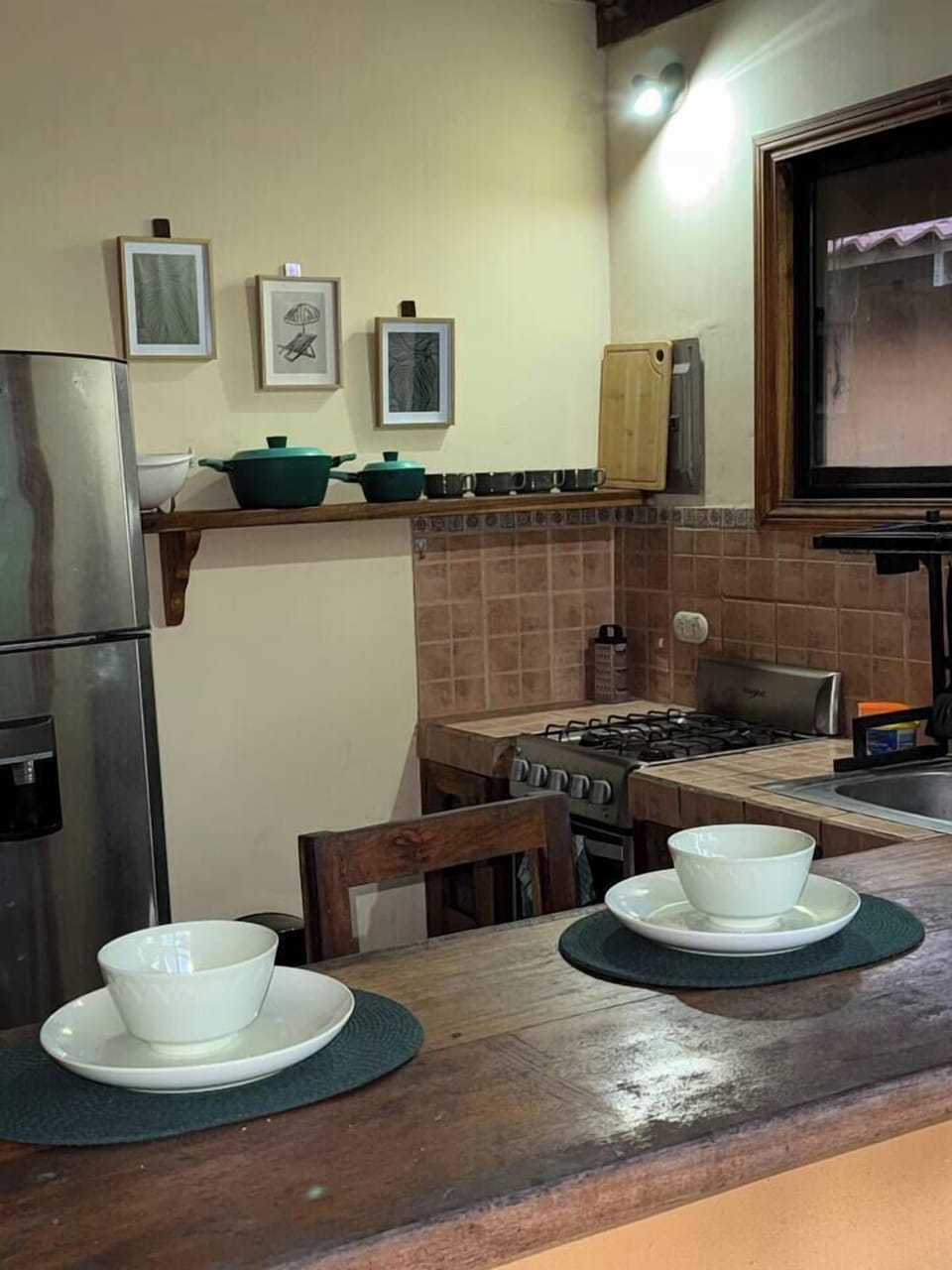 Kitchen includes a 4 burner gas stove, blender, coffee maker, pots, pans, strainer, grater, cutting board, silverware, plates, bowls, coffee cups, glasses, wine glasses and a full size refrigerator. Any additional item can be provided upon request.