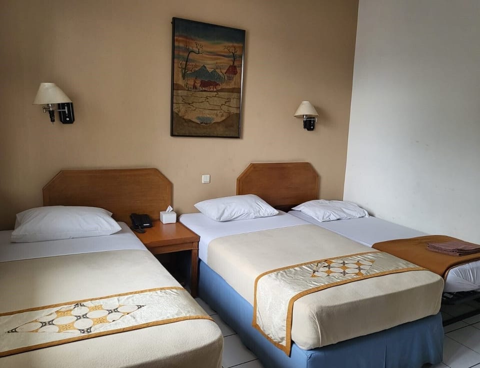 Deluxe Triple Room | Free minibar, in-room safe, desk, blackout drapes