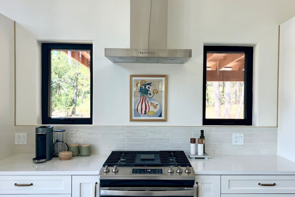 Kitchen with keurig and basic cooking spices and oils