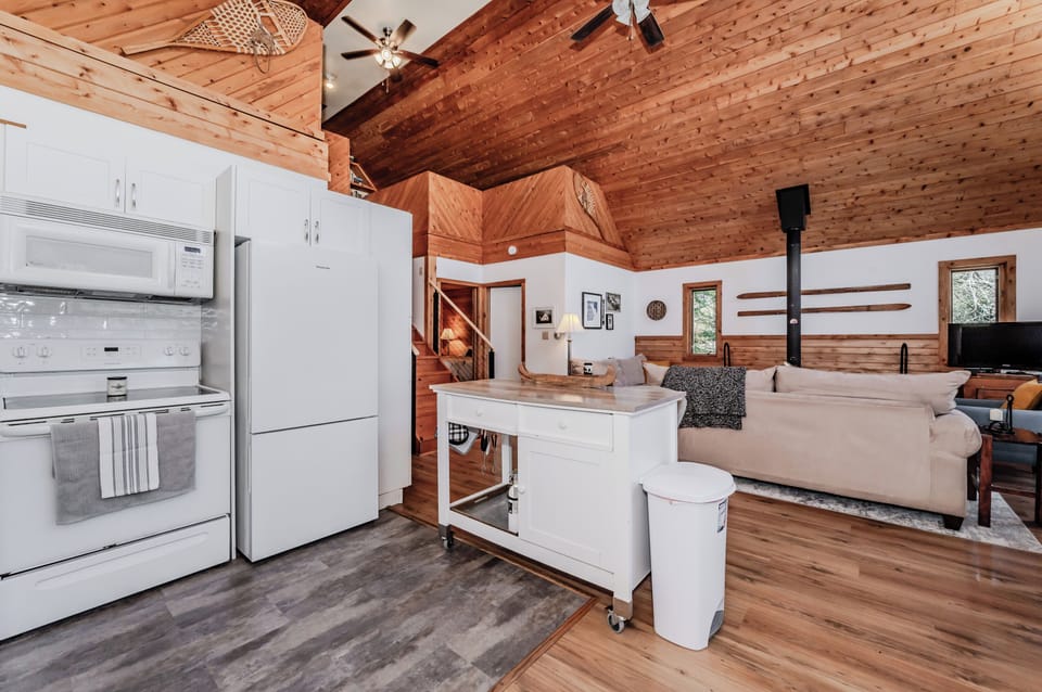 Fully equipped kitchen with modern appliances, open shelving, and island space — everything you need for a relaxing vacation cooking experience.