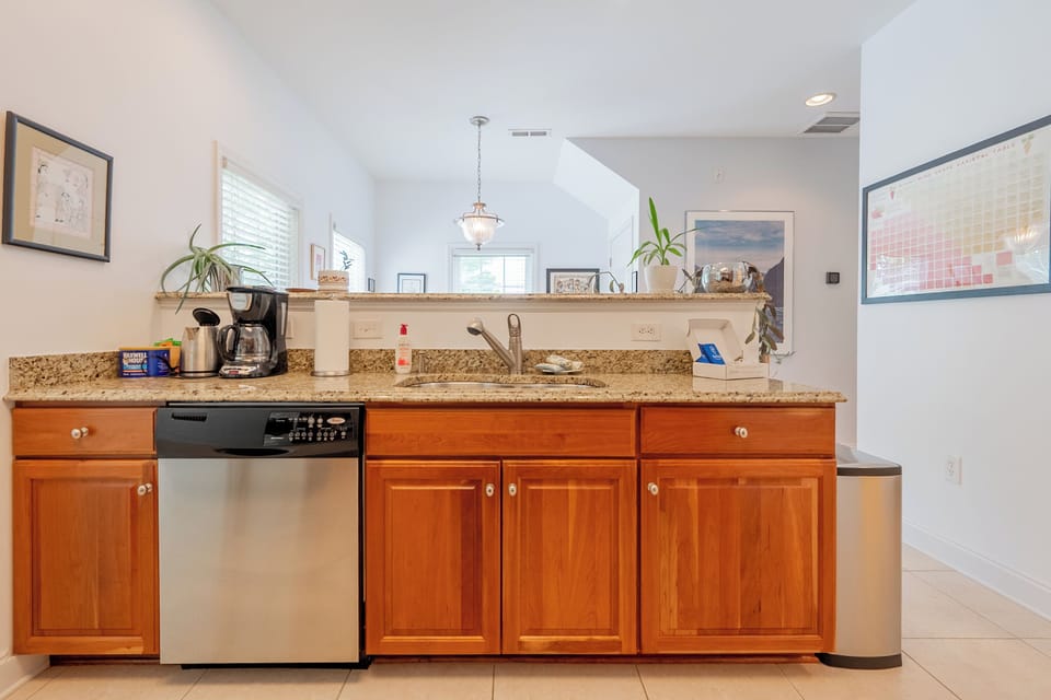 Spacious kitchen island with bar seating, granite counters, and open sightlines to the living area.
