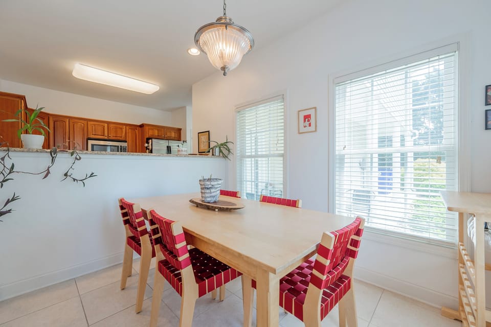 Spacious dining area with seating for five and big windows bringing in plenty of light.