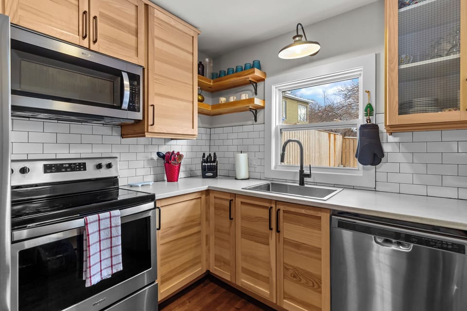 Clean-up is a breeze with a deep sink, dishwasher, and views of the neighborhood.
