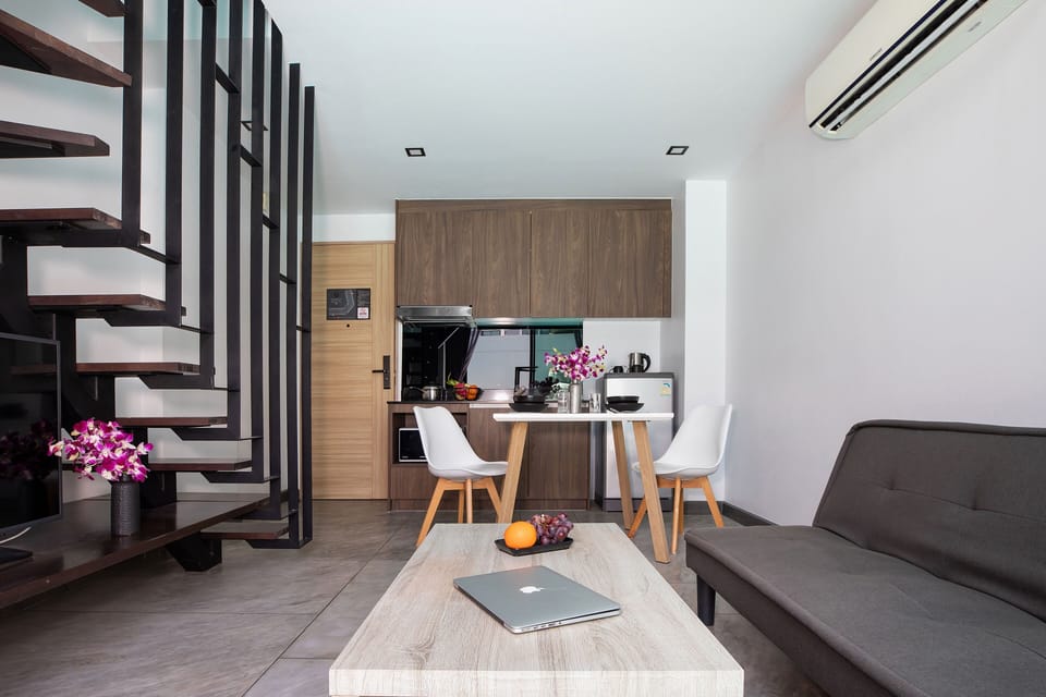 Exclusive Apartment, Balcony, Pool View | Living room | Flat-screen TV