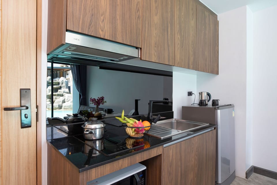 Exclusive Apartment, Balcony, Pool View | Private kitchenette | Electric kettle